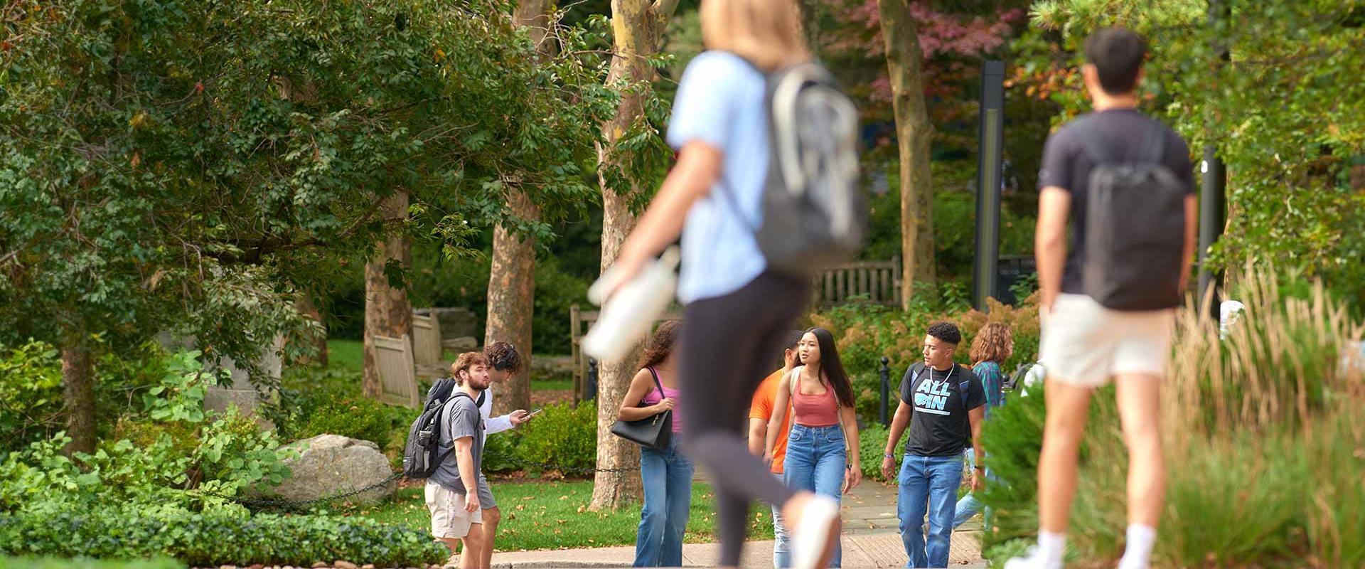Students walking by the Peace Garden between classes